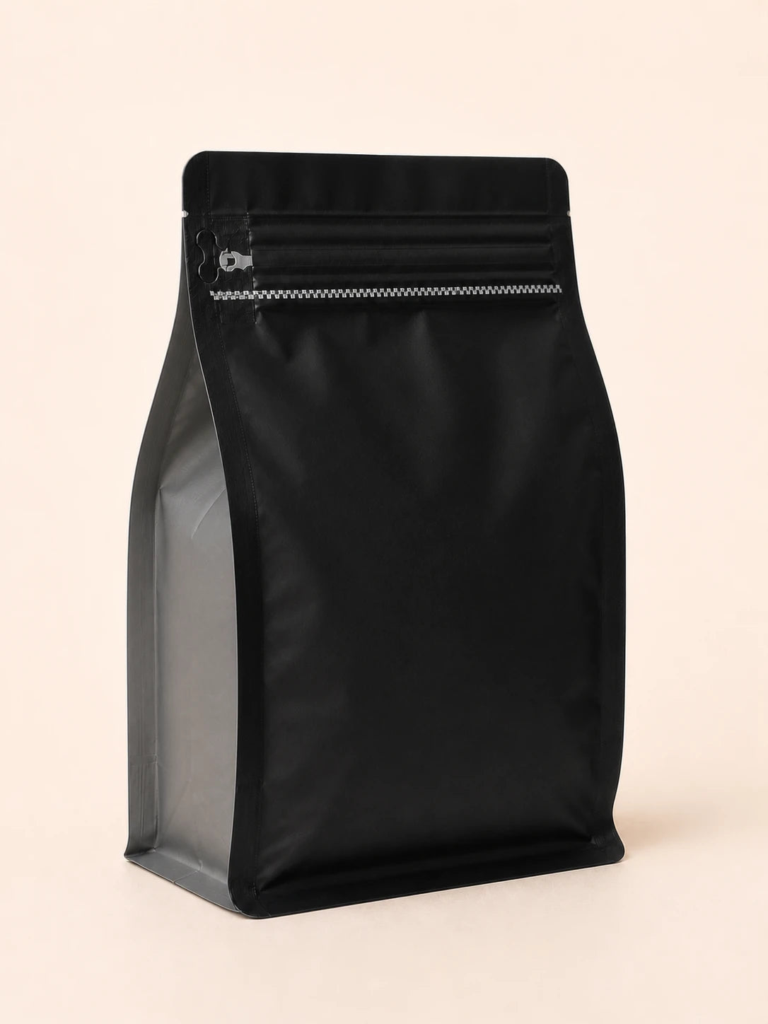Rear view of the Elite Roasters dark roast coffee bag with gray side gusset 
