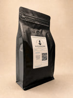 Three-quarter view of the Elite Roasters dark roast coffee bag with gray side gusset 