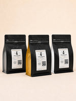 Elite Roasters of Atlanta light, medium, and dark roast coffee bags together